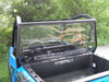 3 Star one-piece Lexan back panel with vent strip installed on a blue Polaris General, seen from the bed
