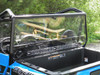 Straight-on view of the 3 Star Lexan back panel and its clamps behind the seats of a blue Polaris General