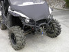 Close front view of a white Yamaha Wolverine with the 3 Star vinyl windshield and hood cover, mud tires and winch