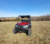 Straight-on front view of the red Hisun Sector 450 with the 3 Star soft top under a clear blue sky