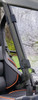 Narrow view of the 3 Star soft top strap and clip on the cage pillar of a green Intimidator GC1K