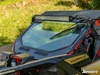 Side angle of the SuperATV glass windshield with vents and wiper on a tan Can-Am Maverick X3 in grass