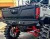 No Limit rear winch bumper with winch installed on a gray Can-Am Defender with red A-arms, rear three-quarter view