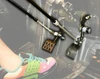 Sure Grip hand control push rods connected to the brake and gas pedals in a side-by-side footwell, driver foot visible