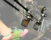 Sure Grip hand control push rods connected to the brake and gas pedals in a side-by-side footwell, driver foot visible