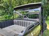 3 Star one-piece rear windshield on a green Segway UT10 Crew, rear view above the cargo bed with cage clamps