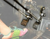 Sure Grip hand control linkage rods installed at the pedals of a side-by-side footwell with a driver foot visible