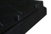 Close-up of the Moto Alliance Can-Am Defender cargo bed cover corner showing the black textured lid and latch