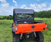 Straight rear view of the 3 Star full cab enclosure on an orange Bad Boy Bandit showing the clear rear window