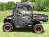 3 Star full cab enclosure installed on a black side-by-side with red-rim wheels, driver side profile in a field