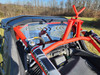 3 Star rear window panel on a Segway Villain seen from behind the red cage, clear vinyl window with vent slots