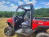 3 Star rear panel and top on a red Argo Magnum XF 1000 LE with the door opening open, driver side view in a field