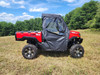 Driver side view of a red TGB LandMax 1000 with the 3 Star full soft doors closed in a field