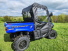 3 Star door and rear panel combo on a blue Massimo T-Boss 410, rear three-quarter view over the bed on grass