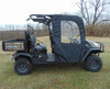 3 Star front door and center panel enclosing the front cab of a Kubota RTV X1140, side view in a field