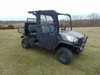 Front three-quarter view of a Kubota RTV X1140 with the 3 Star front doors and center panel enclosure