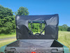 Straight rear view of the 3 Star soft rear window panel above the cargo bed of a green Yamaha Rhino