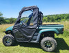 3 Star half doors with clear windows on a green Yamaha Rhino, driver side profile in a field