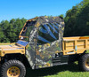 3 Star door and rear window combo in camo installed on a tan Tuatara, driver side view on grass
