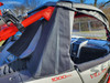 Close-up of a 3 Star upper soft door on a Segway Villain beside the red cage, black fabric with mesh side panel
