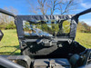 Inside view of the 3 Star soft center panel with clear window behind the front seats of a CFMoto UForce 1000XL