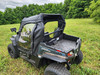 3 Star soft doors with clear windows on a black HiSun Strike 250, rear three-quarter view in a field