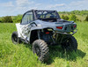 Rear three-quarter view of a white Arctic Cat Wildcat XX with the 3 Star rear window panel and upper doors