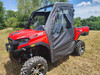 3 Star full soft doors installed on a red TGB LandMax 1000, front three-quarter view in a field