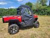 Driver side view of a red TGB LandMax 1000 with the 3 Star full soft doors and vinyl windows