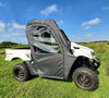 3 Star soft doors installed on a white Kymco 700, driver side view parked in a grassy field