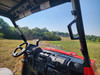 3 Star one-piece scratch-resistant windshield on a red TGB LandMax 1000 seen from inside over the dash and wheel