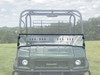 Close-up of the 3 Star two-piece windshield with vent strip on a green Kawasaki Mule 4000 Trans, front view
