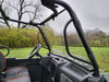 View from inside the Intimidator GC1K 3-seater cab through the 3 Star windshield, steering wheel in frame
