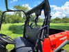 3 Star soft back panel seen from the cab of a red Tracker Off Road 500S, looking back over the seat