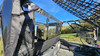 Close-up of the 3 Star soft center panel from the rear seat area of the Honda Pioneer 1000-5 with cargo net above