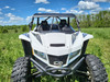 3 Star soft top for a hard windshield on a white Arctic Cat Wildcat XX, straight front view in a field