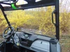 Inside view of the 3 Star one-piece windshield from the passenger seat of a gray side-by-side cab
