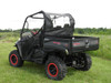 Rear three-quarter view of a black side-by-side with red wheels wearing the 3 Star soft back panel and top
