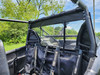 Inside view of the 3 Star canvas rear panel behind the rear seats and harnesses of a Kawasaki Teryx KRX Crew