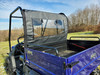 3 Star soft back panel with clear window behind the cab of a blue Bison 400U, seen from the cargo bed