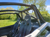 3 Star soft back panel with clear window behind the seats of an Arctic Cat Wildcat XX, viewed from the cab