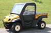 Greene Mountain cab enclosure on a yellow Cub Cadet Volunteer with clear windshield and black soft doors