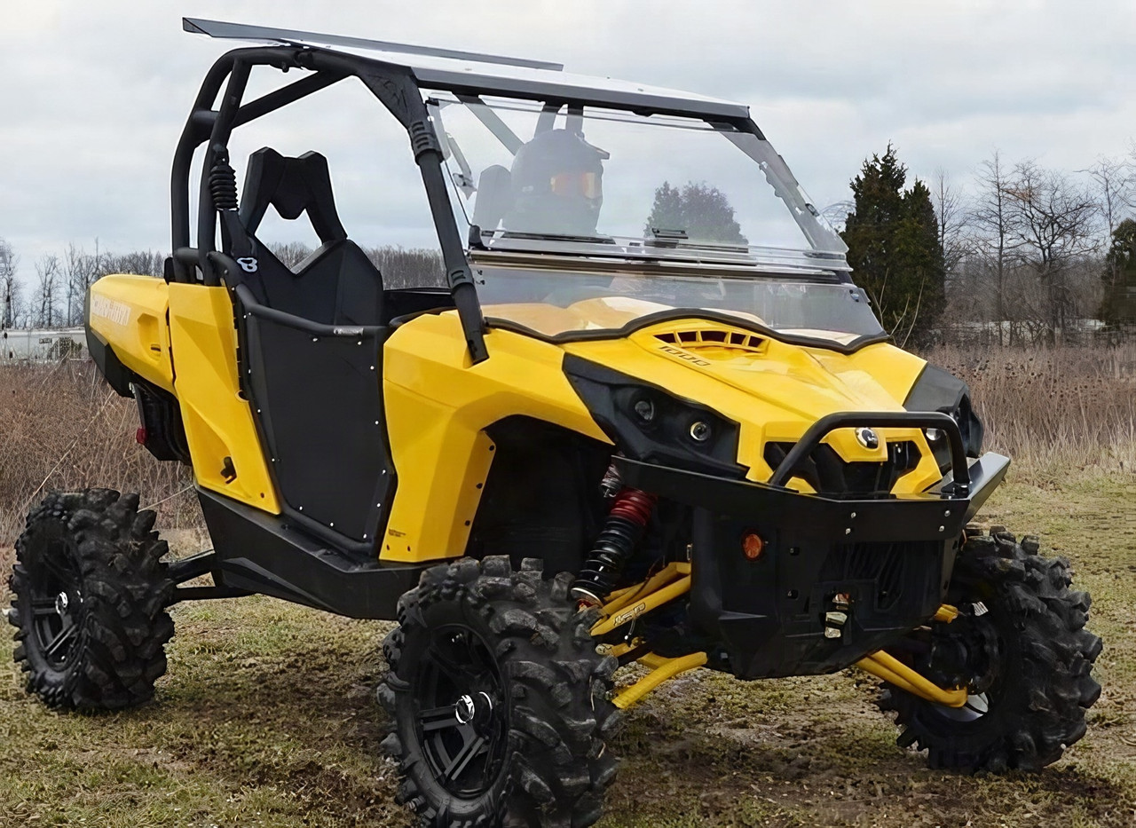 SuperATV scratch-resistant flip out windshield on a yellow Can-Am Commander, front three-quarter view