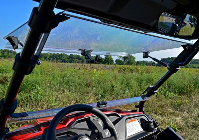 View from inside the Honda Pioneer 500 cab of the SuperATV windshield propped open