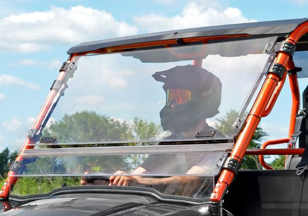 SuperATV flip-out windshield in the closed position on a Kawasaki Mule Pro-FXT with orange cage, front view
