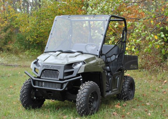 Front three-quarter view of the olive green mid-size Polaris Ranger with the SuperATV full windshield on grass
