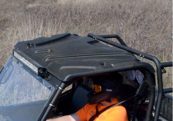 SuperATV plastic roof on a full size Polaris Ranger with an LED light bar under the front edge, seen from above
