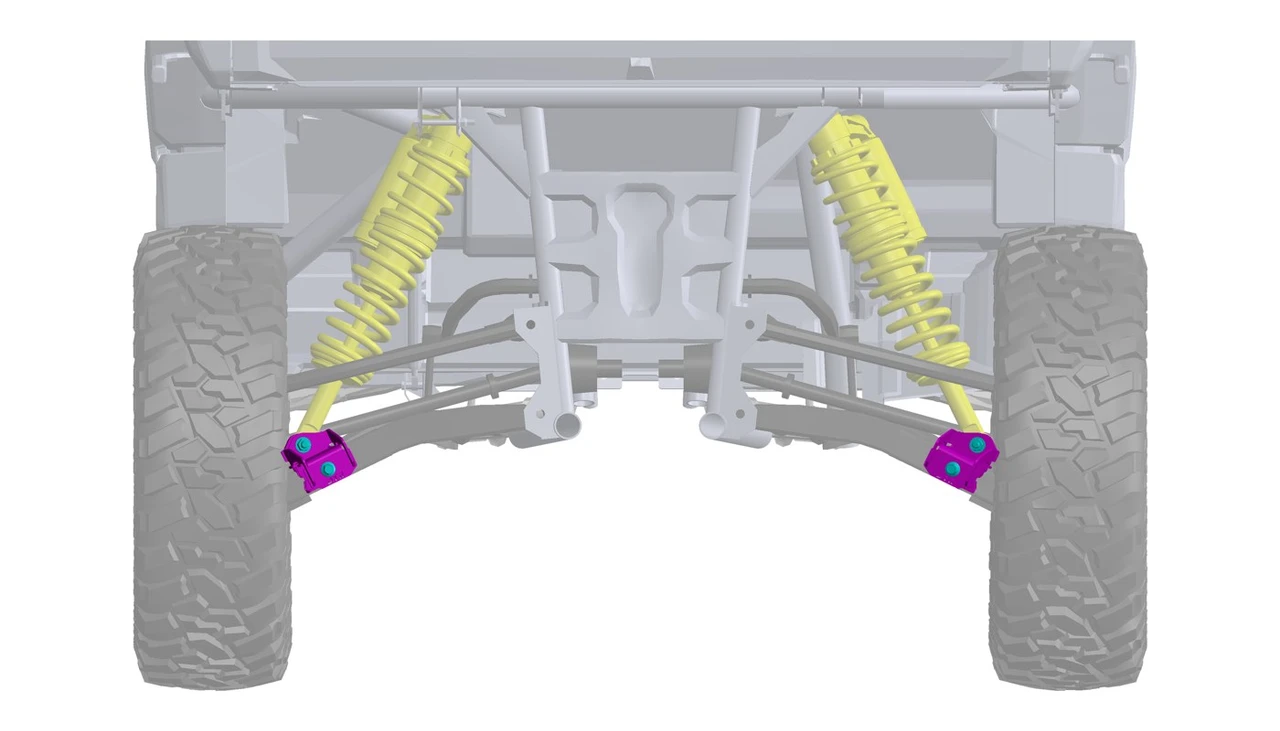 Rear view of the Dirty Teeth Racing 2-inch lift blocks installed at the Polaris Xpedition rear shock mounts