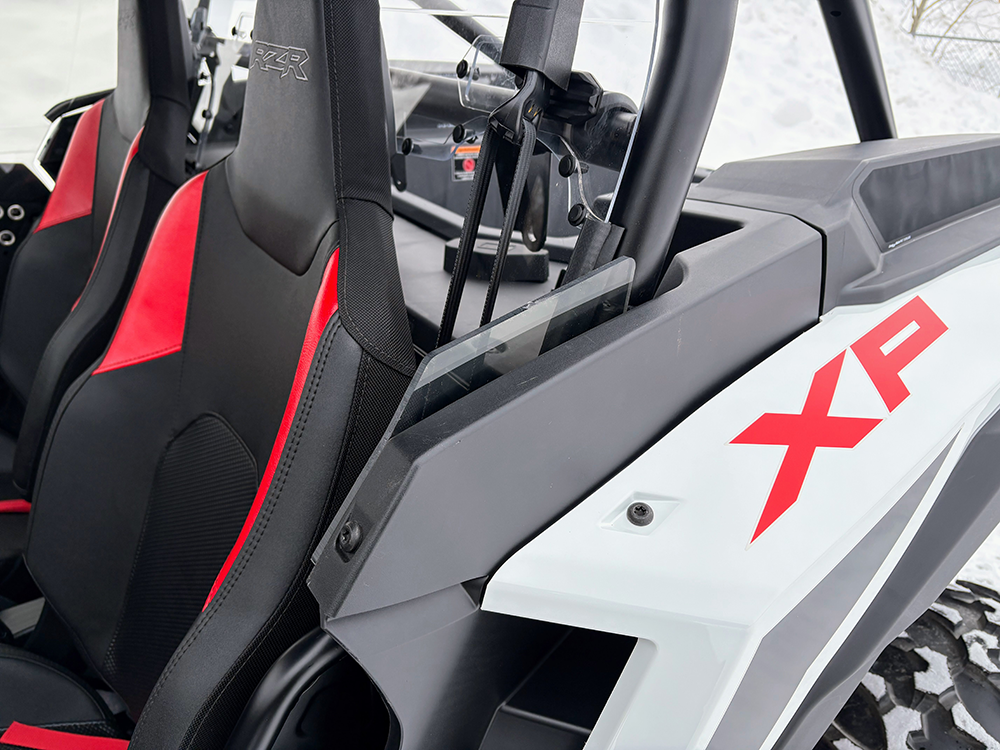 SCM door kit for Polaris RZR XP 1000 2-seat: upper door edge beside the seat of a white Polaris RZR XP