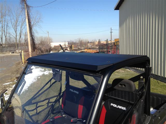 Extreme Metal Products aluminum roof installed on a red Polaris Ranger with windshield, front three-quarter view